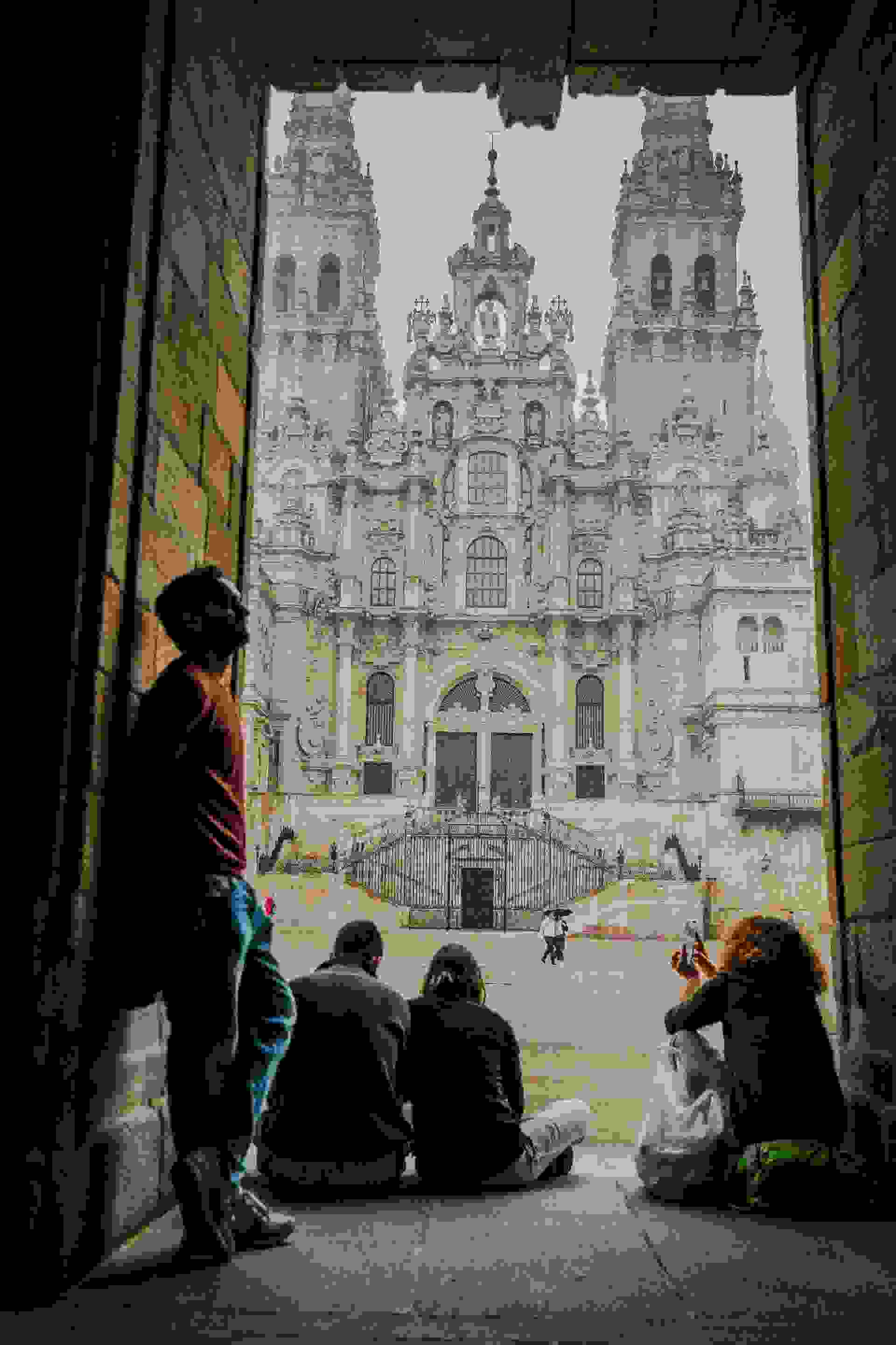 people walking near brown concrete building during daytime